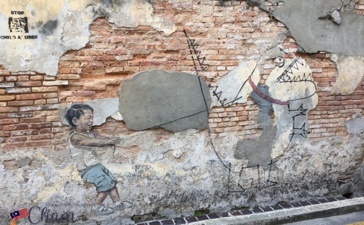 Ernest Zacharevicによるペナンストリートアート（Little Boy with Pet Dinosaur）